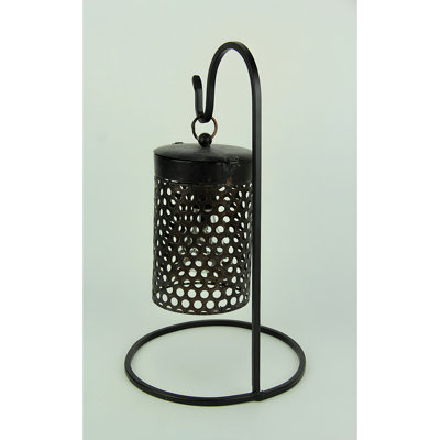 Contemporary black metal and tin mesh LED lantern with plastic bulb and stand, 16 inches high