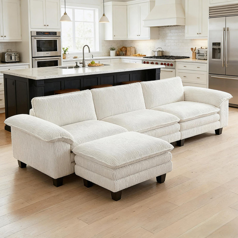 Canapé modulaire de luxe en forme de L avec accoudoirs coussinés et repose-pieds mobile pour une assise confortable, Beige