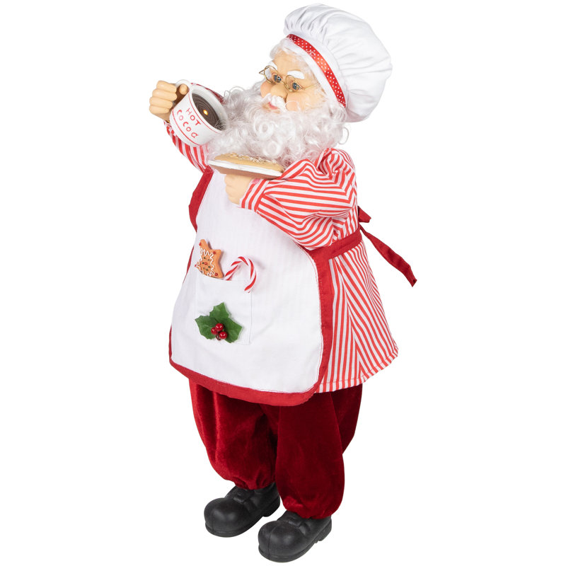 Chef avec figurine chocolat chaud et biscuit