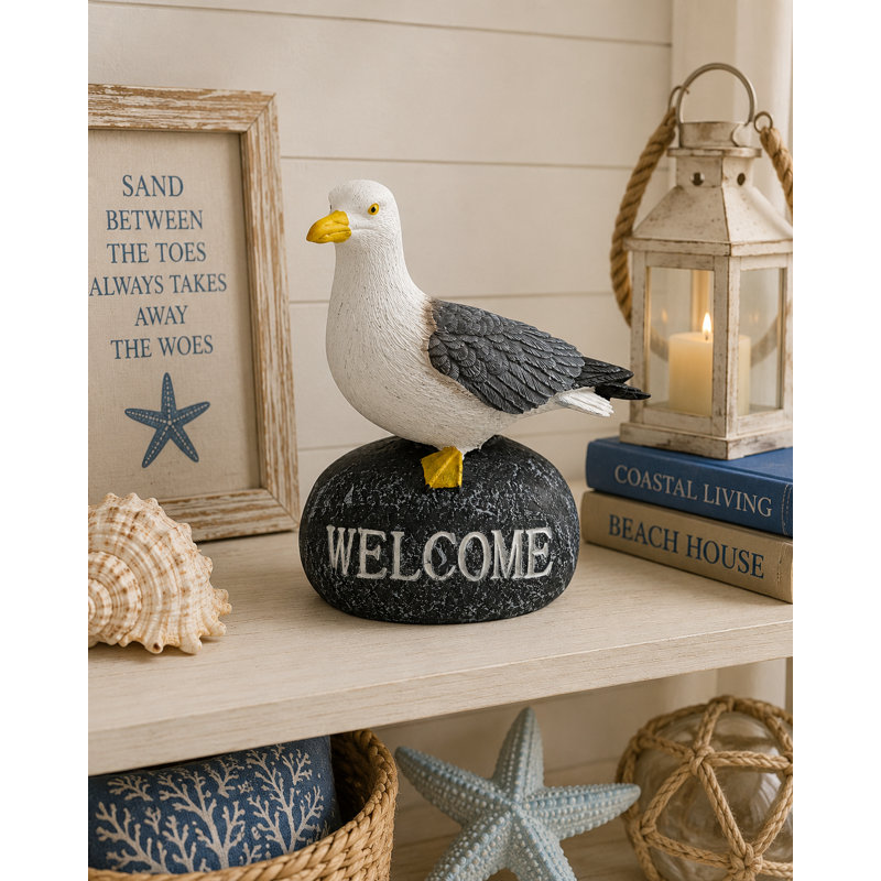 Figurine de mouette sur une pierre de bienvenue