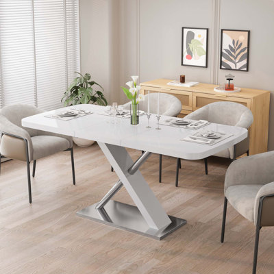 Table de salle à manger moderne extensible avec base croisée en métal et tubes en acier inoxydable