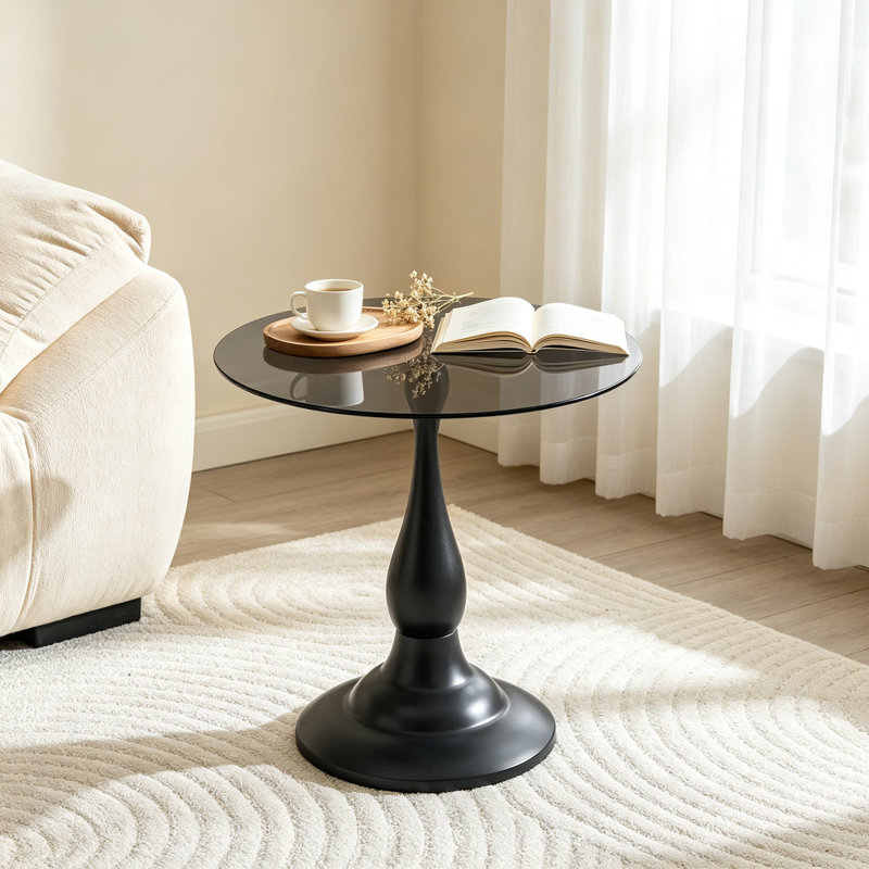 Table d'appoint vintage en métal noir mat, plateau rond en verre trempé gris translucide de 50 cm, pied en forme de vase, idéale pour le salon ou la chambre.