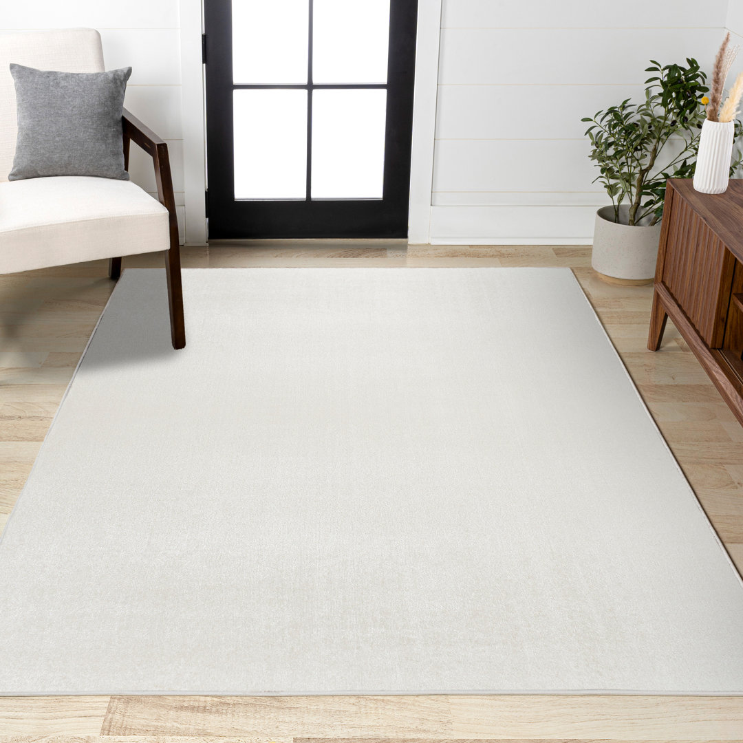 Yaniyah Classic Solid Low-Pile Machine-Washable Cream Rug Gracie Oaks Rug 