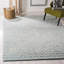 Tapis bleu en laine touffeté à la main Costin-61343295
