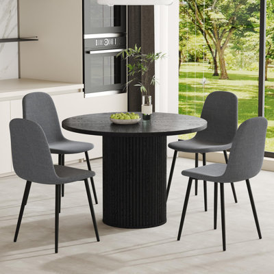 Ensemble de table de salle à manger 5 pièces comprenant un plateau en bois noir et une base cylindrique. Ensemble de table de salle à manger 42 po pour 4 personnes alliant stabilité, confort et style contemporain.