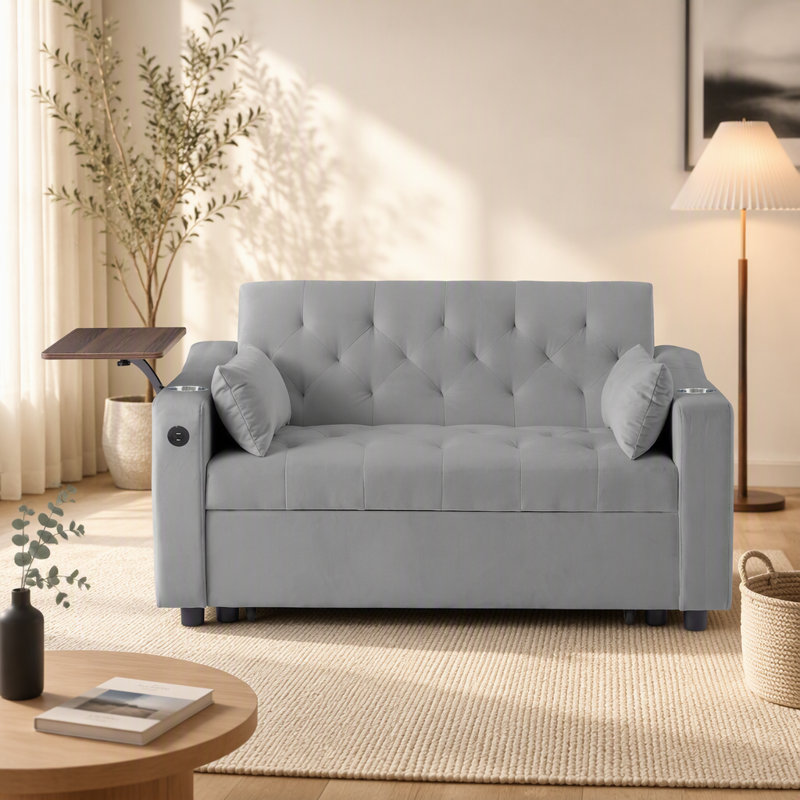 Canapé-lit en velours gris avec table d'appoint, porte-gobelet et port USB pour un confort et une commodité modernes.