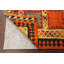 Tapis orange / jaune à motif géométrique en laine Aakiyah