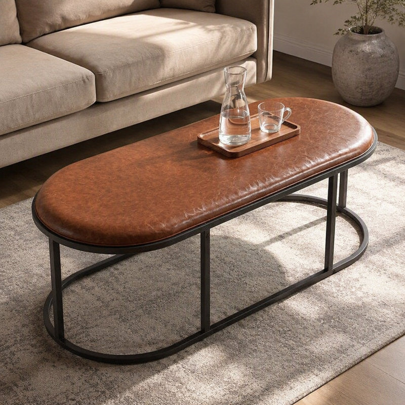 Table basse ovale en similicuir, table centrale rembourrée avec base en métal