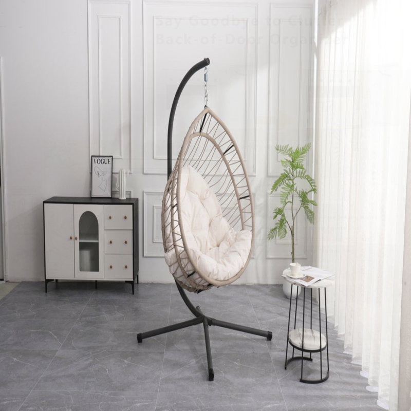 Élégante chaise suspendue d'extérieur en forme d'œuf avec support, parfaite pour la détente et le patio élégant ou à l'intérieur.
