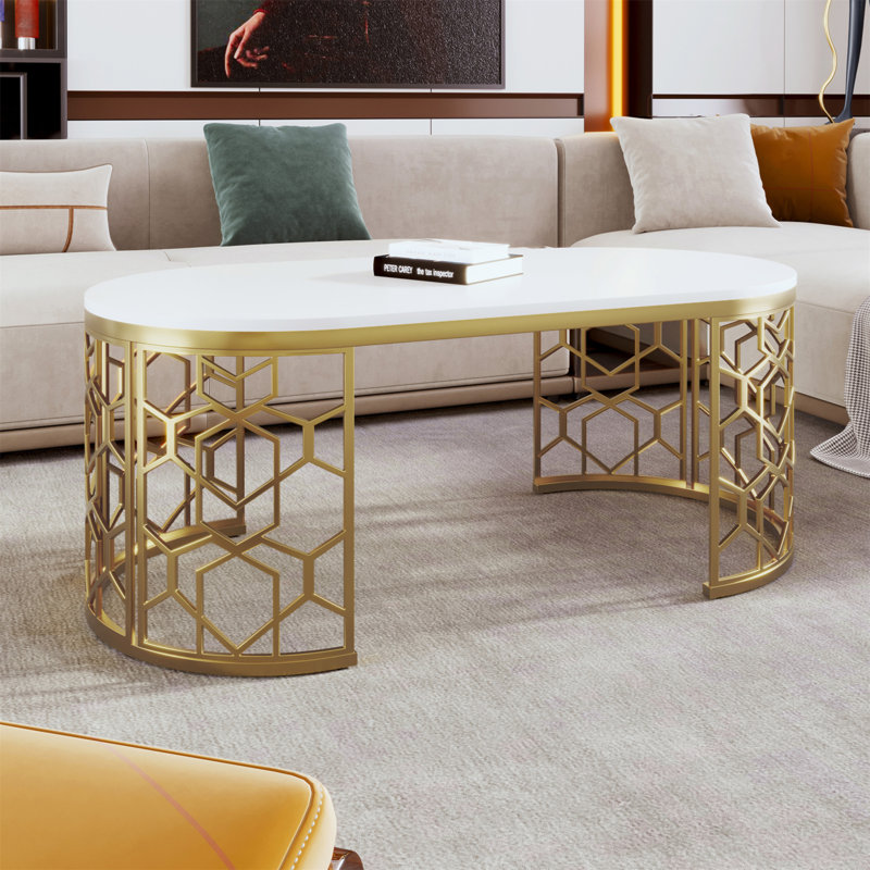 Table basse moderne ovale avec structure en acier inoxydable