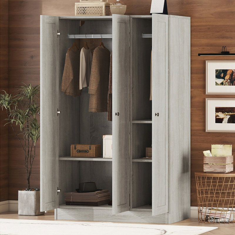 Armoire à 3 portes à volets avec des tablettes spacieuses pour les chambres modernes et organisées, fabrication en panneau de fibres à densité moyenne de haute qualité.