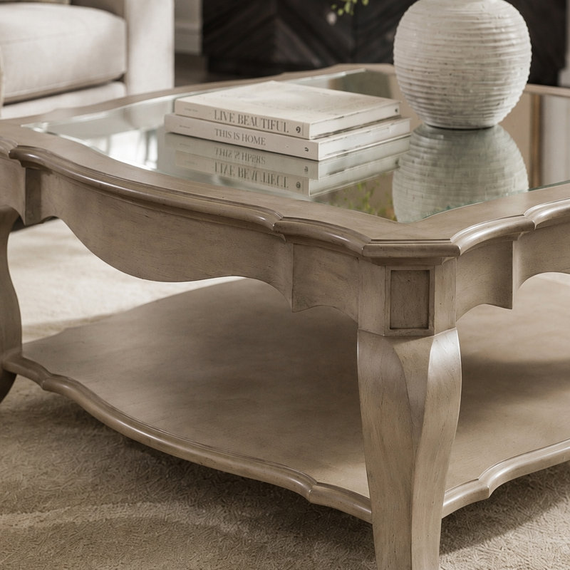 Table basse en verre transparent et finition taupe antique