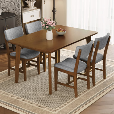 1 table en bois massif et 4 chaises rembourrées