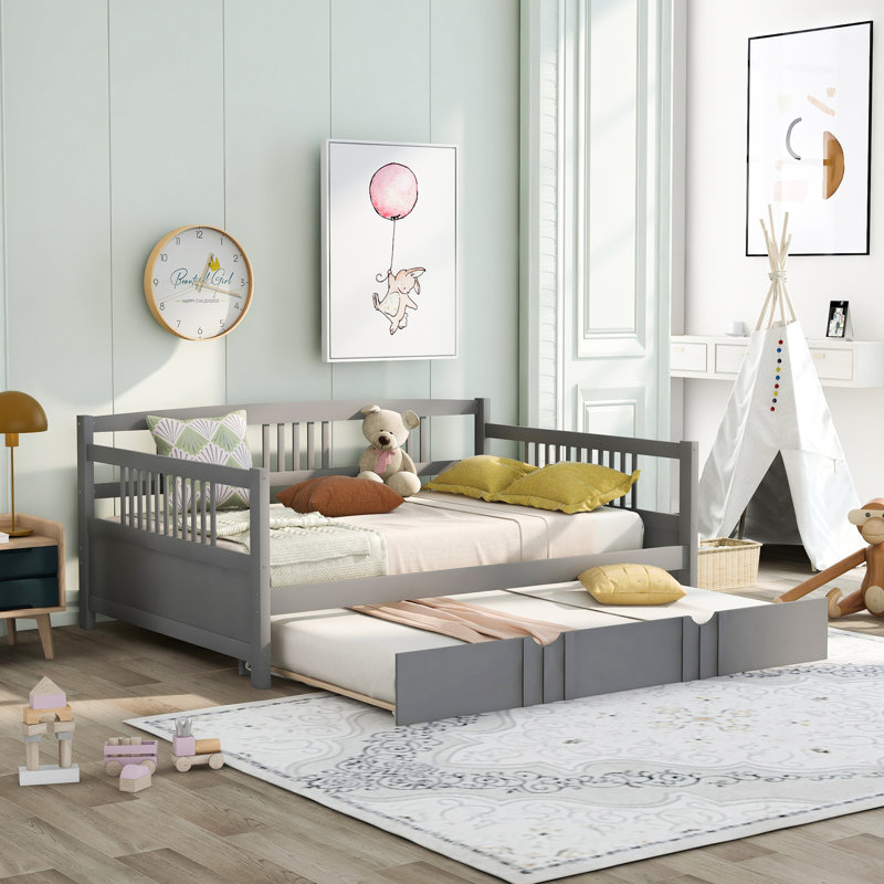 Versatile Wood Daybed With Trundle For Relaxation And Extra Sleeping Space, Ideal For Small Living Areas And Family Use.