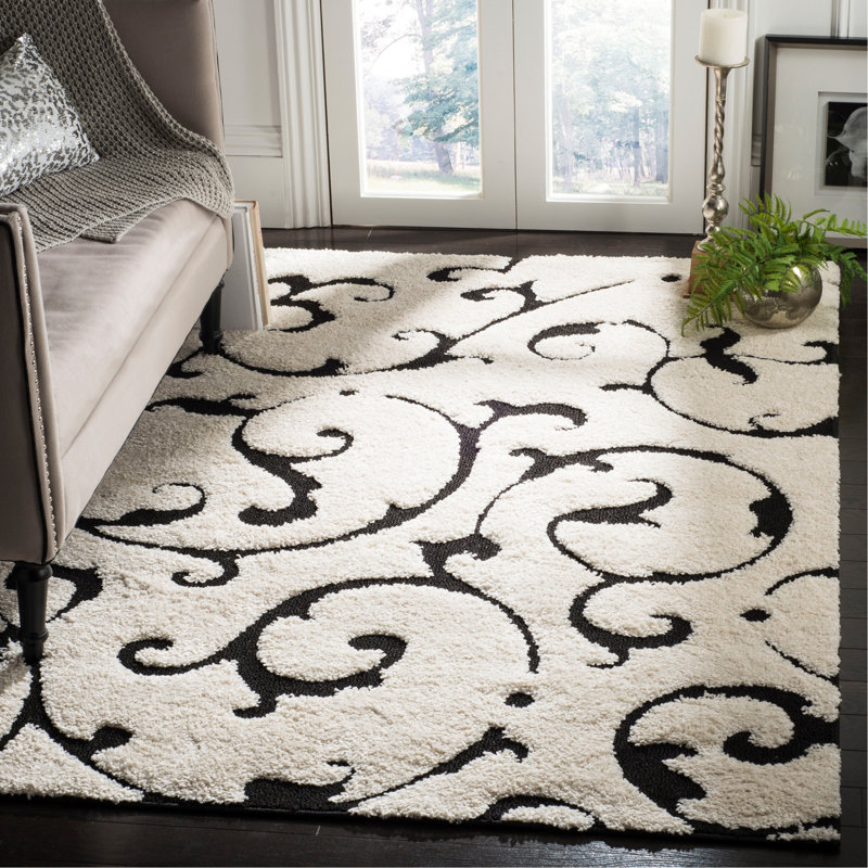 Tapis floral en polypropylène tissé à la machine Tess en ivoire / noir, Rectangle 5 pi 3 po x 7 pi 6 po