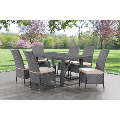 Arzan 6 - Person Wicker Patio Dining Set with Rectangular Table , Cushions Included