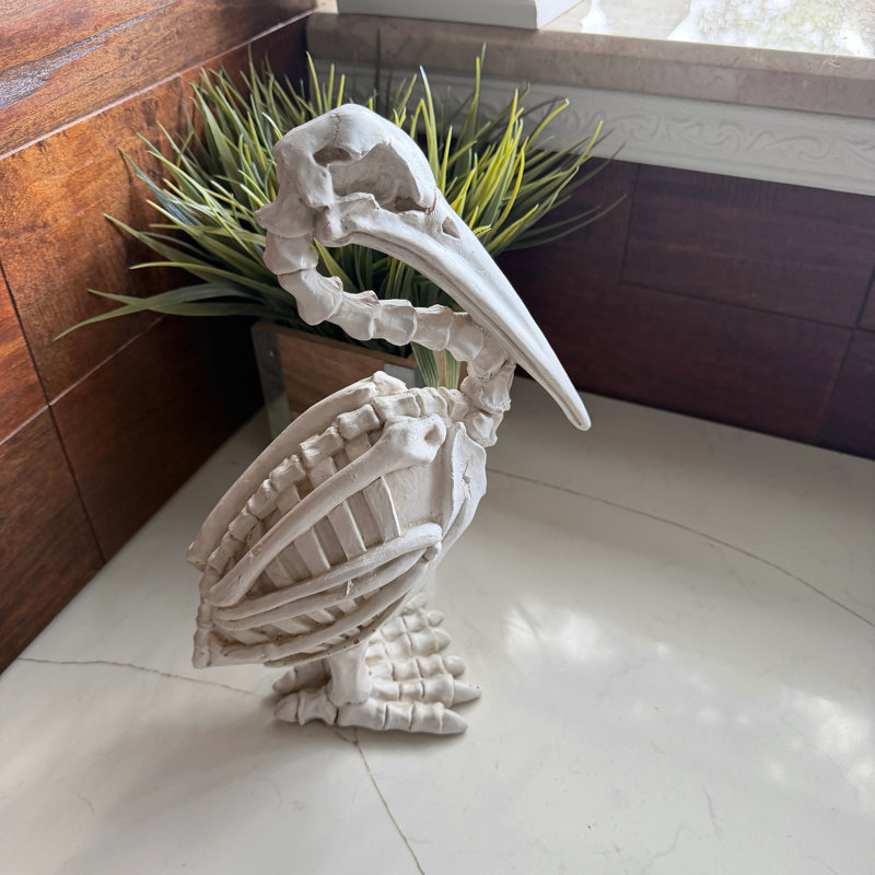 Statue de squelette de pélican gothique en résine blanche avec finition os vieillie, 29 cm de hauteur