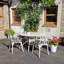 Ryne 4 - Person Patio Dining Set with Round Table , Cushions Included-41176032
