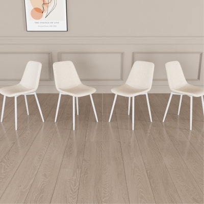 De 4 chaises de salle à manger en lin beige, fabriquées en métal, convenant à différents styles de chaises modernes en lin, avec structure et créant un environnement confortable