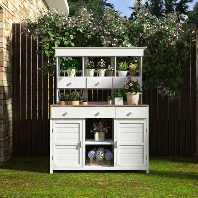 Table de jardin avec 3 tablettes, 6 tiroirs et 2 armoires inférieures