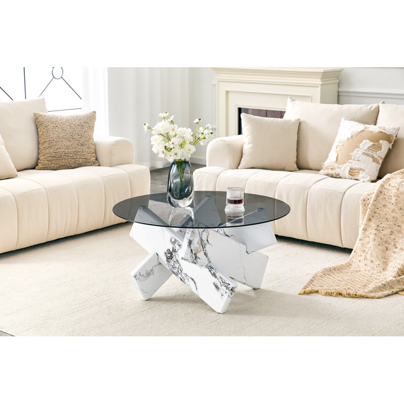 Table basse ronde artistique en forme de X. Verre trempé gris fumé + base en panneau de fibres à densité moyenne à motif de marbre bulgari blanc, table basse de salon luxueuse et légère.