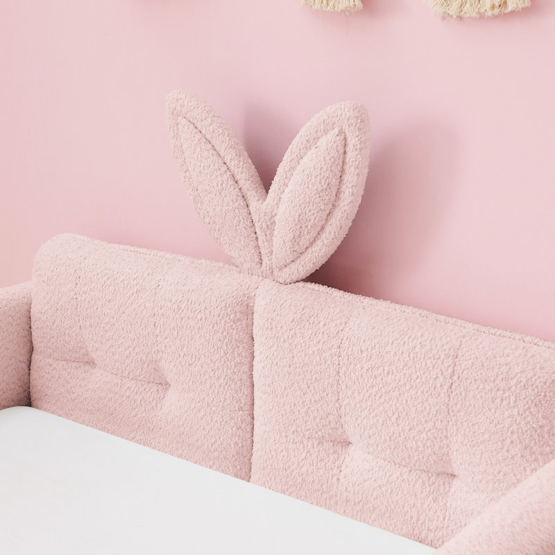 Lit simple tapissier à boucle simple rose, avec une jolie tête d'oreille de lapin, des panneaux et un espace de rangement pour la conception du lit