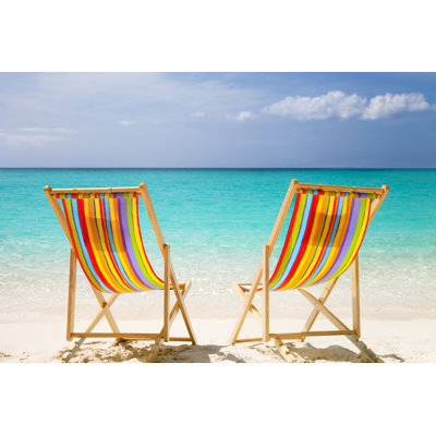 Colorful Chairs At A Topical Caribbean Beach by Cdwheatley - No Frame Print on Canvas