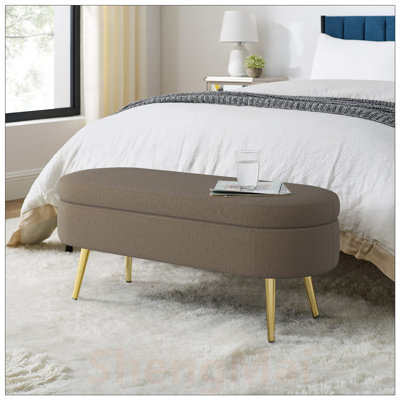 Banc de rangement repose-pieds ovale en flanelle avec pieds en métal pour plus de confort et d'organisation