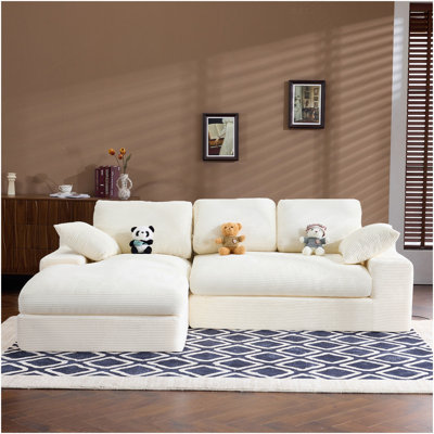 White Corduroy Compressed Sofa. It Has A Soft And Skin-Friendly Sitting Feel, Adding A Healing Atmosphere To The Warm Living Room. It Comes With 3 Back Cushions And 2 Throw Pillows.