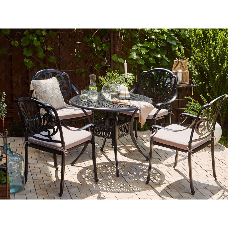 Helland 4 - Person Patio Dining Set Round Table with Cushions Included, Grey, Black