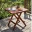 Petite table pliante en teck, finition huilée