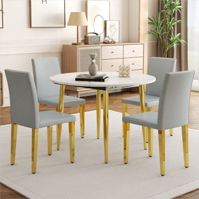 Table de salle à manger extensible ronde en bois aggloméré avec 4 chaises en polyuréthane gris, finition blanche et dorée, conversion ovale