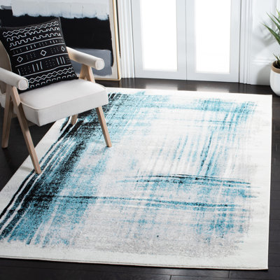 Tapis abstrait ivoire / bleu sarcelle