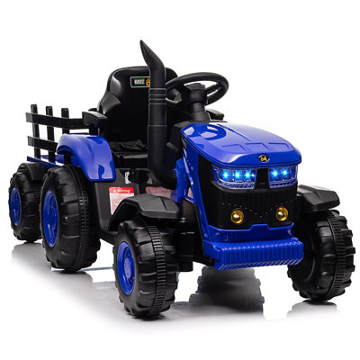 Les enfants électriques montent sur un tracteur avec une remorque, un véhicule alimenté par batterie 12V