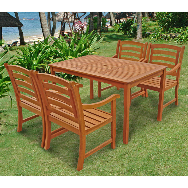 Izaguirre 4 - Person Eucalyptus Solid Wood Patio Dining Set Umbrella Hole Included Rectangular Table