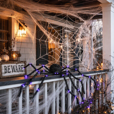 Décoration d'Halloween araignée lumineuse géante de 119 cm (47 pouces) avec pattes flexibles à DEL violettes, fonctionne sur piles, accessoire de jardin pour maison hantée