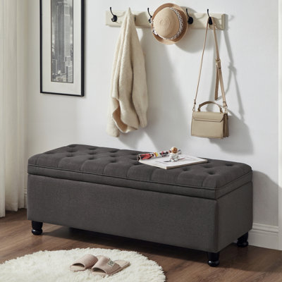 Banc de rangement en lin gris foncé avec boutons élégants