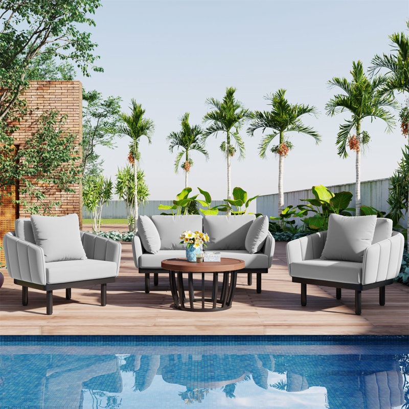 Ensemble de conversation luxueux avec cadre en fer et table basse en bois d'acacia pour divers espaces