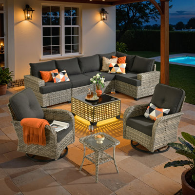 Carolle 7-Piece Modular Outdoor Rattan Seating Set with Cushions, Swivel & Rocking Chairs, Patio Table with Built-In Lights for Deck or Backyard by Lark Manor
