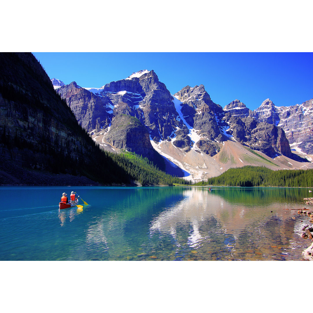 Canoeing On Moraine Lake - Wrapped Canvas Print