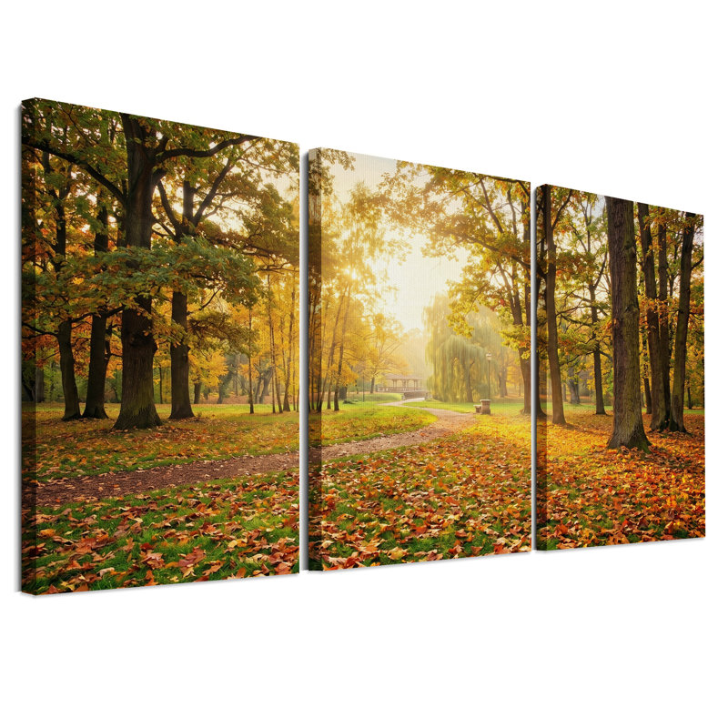 Ensemble de 3 toiles murales représentant un sentier d'automne ensoleillé dans un parc, avec des feuilles orangées