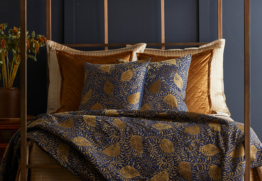 Navy and gold paisley bedding.