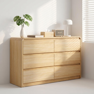 Commode moderne à 6 tiroirs avec comptoir spacieux, poignées dissimulées et coins arrondis pour la chambre à coucher et le salon