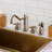 Kingston Brass Heritage Double-Handle 4-Hole Widespread Kitchen Faucet with Brass Sprayer