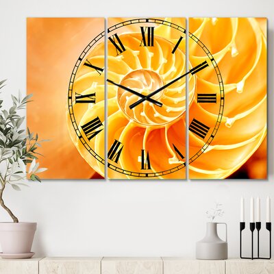 Yellow Nautilus Shell - Traditional wall clock -  East Urban Home, 26A6997CE379429F8A91BAE4A5777F0B
