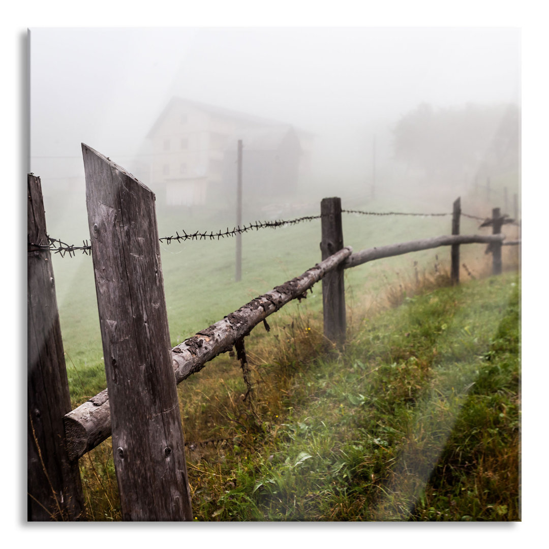 Glasbild Holzzaun auf Wiese