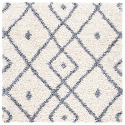 Tapis ivoire à motif géométrique