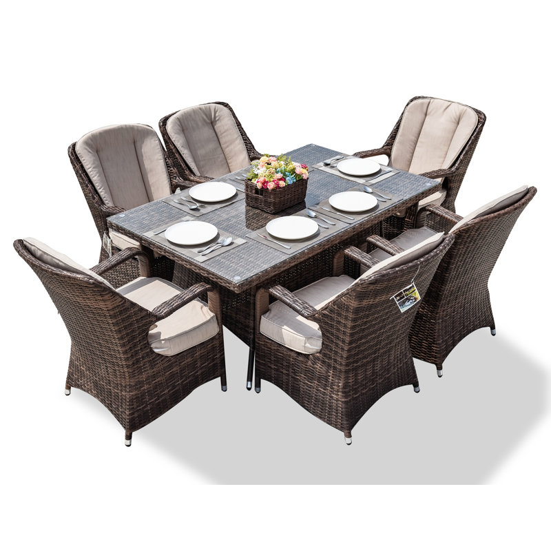 Algird 6 - Person Wicker Patio Dining Set with Rectangular Table , Cushions Included, Brown Frame/Beige Cushion