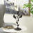 Cole And Grey Polystone Perching Bird Decorative Sculpture With Leaf Vine And Copper Shading