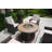 Areefa 4 - Person Wicker Patio Dining Set with Round Table , Cushions Included